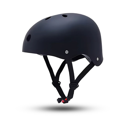 A black safety skate helmet for kids with ventilation holes and an adjustable chin strap