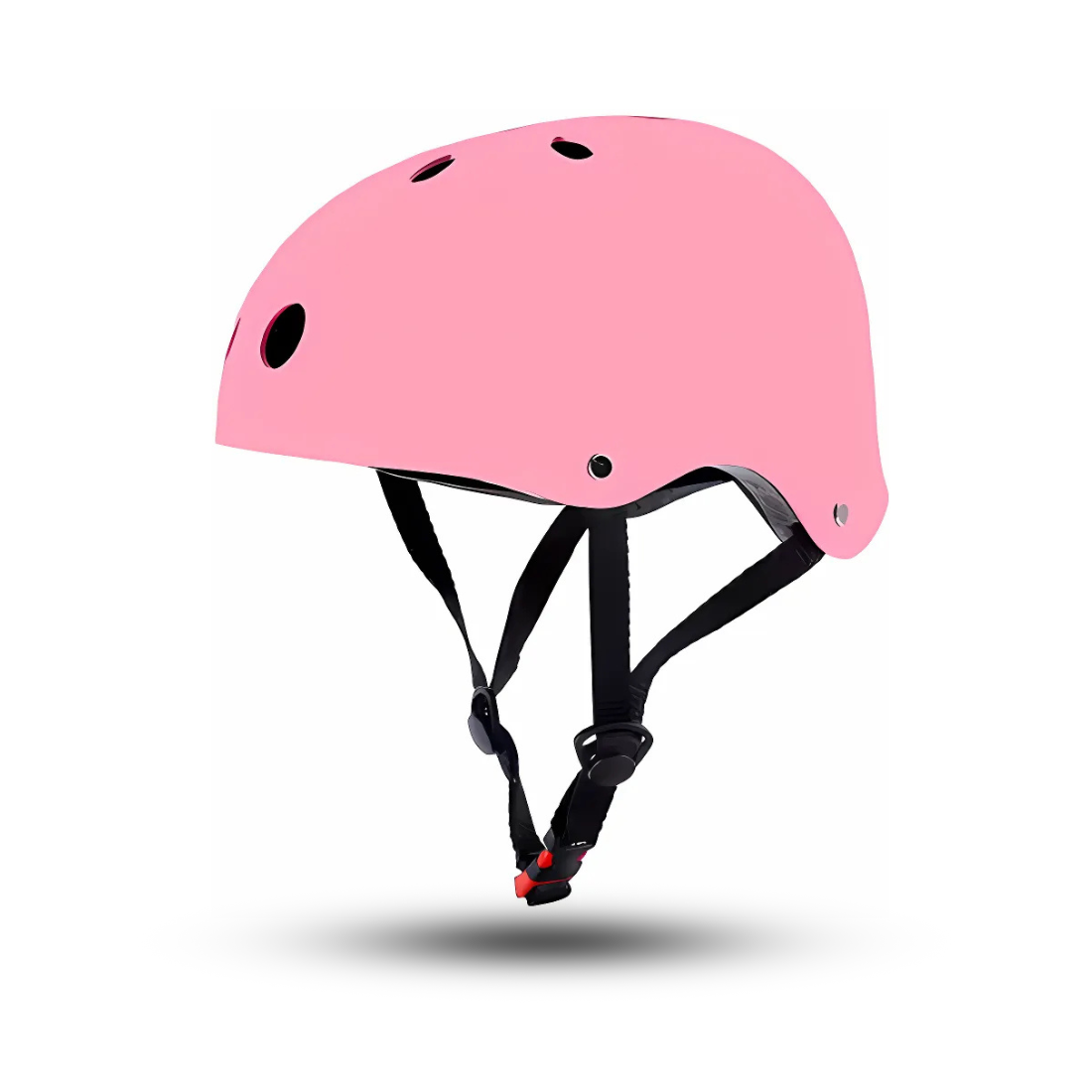 A pink safety skate helmet for kids with ventilation holes and an adjustable chin strap