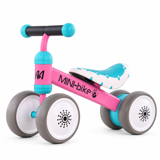 Pink 4-wheel toddler balance bike with aqua and white seat and wide quiet wheels