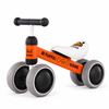 Orange 4-wheel toddler balance bike with white seat and wide quiet wheels